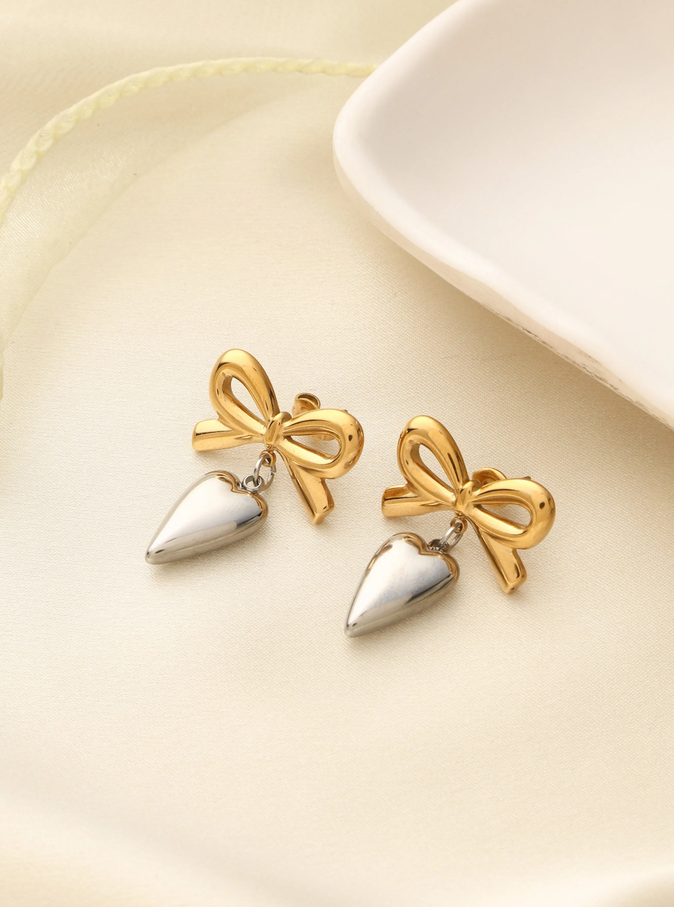 Klissaa Steel Bow-Heart Earrings